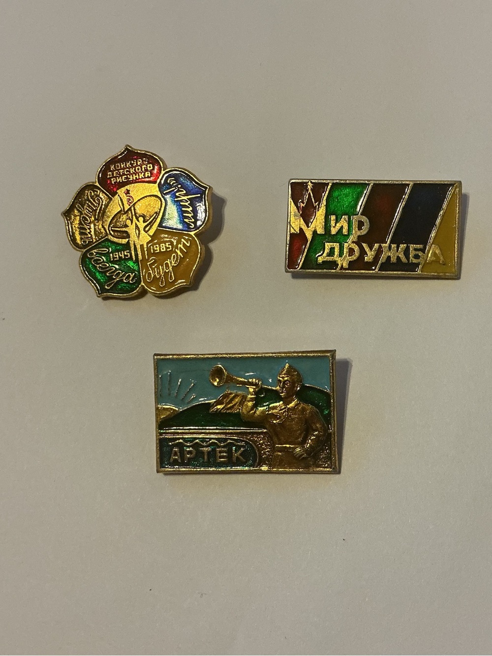Three Colorful Soviet-Era Enamel Lapel Pins.